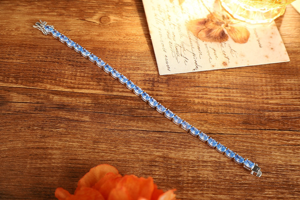 This S925 silver bracelet has blue gems, oval shape, and a practical clasp, pretty.