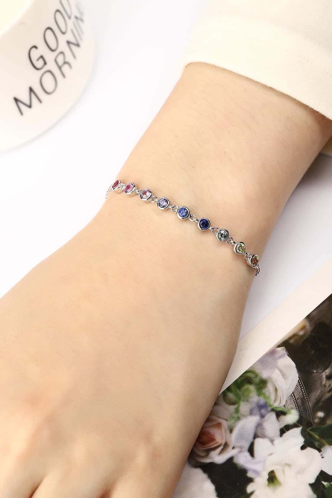 Made of S925 silver, colorful sapphires shine, round - shaped, with extender and clasp, lovely.