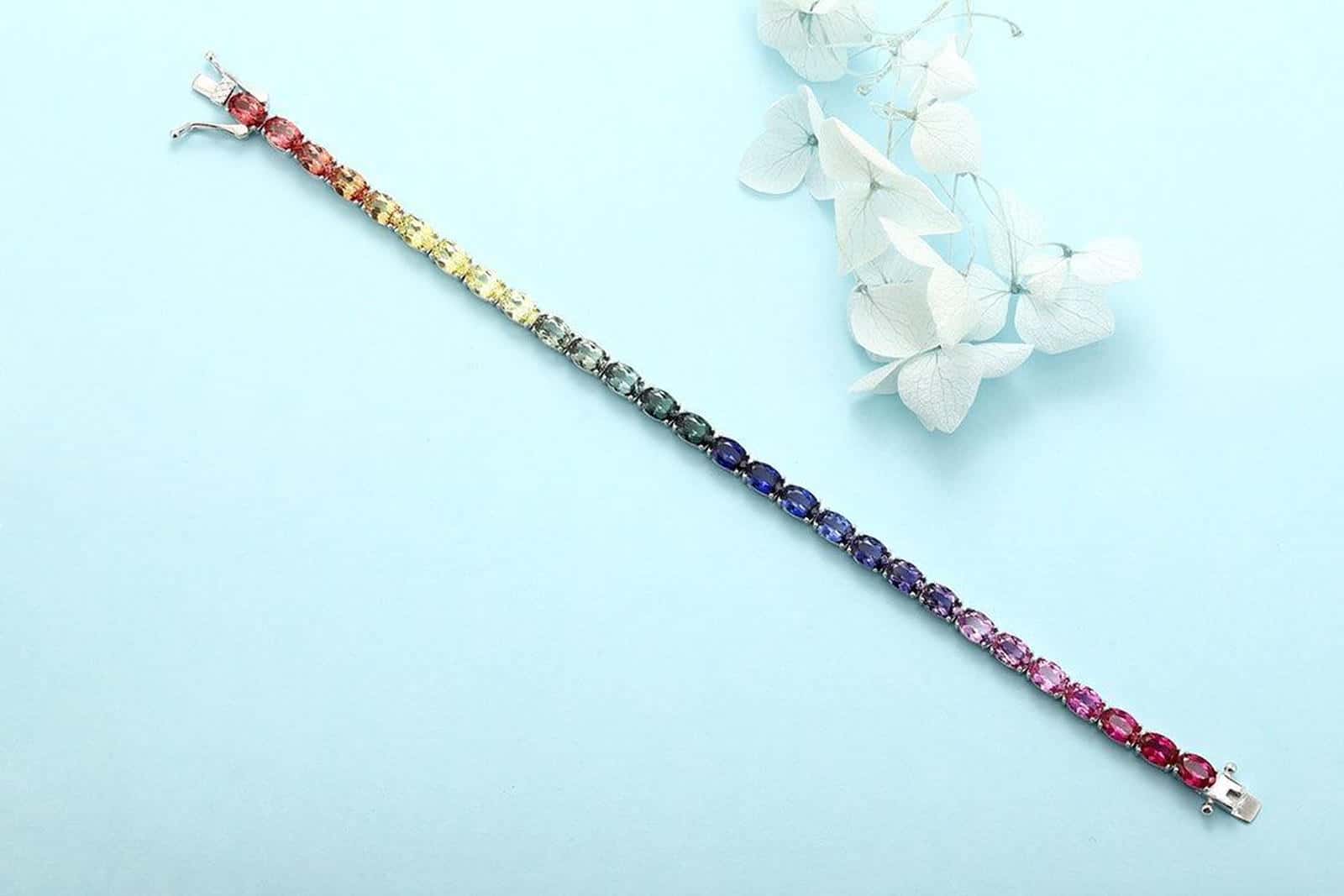 S925 silver brace, multi - hued sapphires, oval gems, box - style clasp, 18cm chain, pretty.