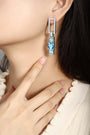 S925 silver earrings, sturdy clasp. Show diamond-set rectangles and square blue lab-grown diamonds, chic geometric shape.