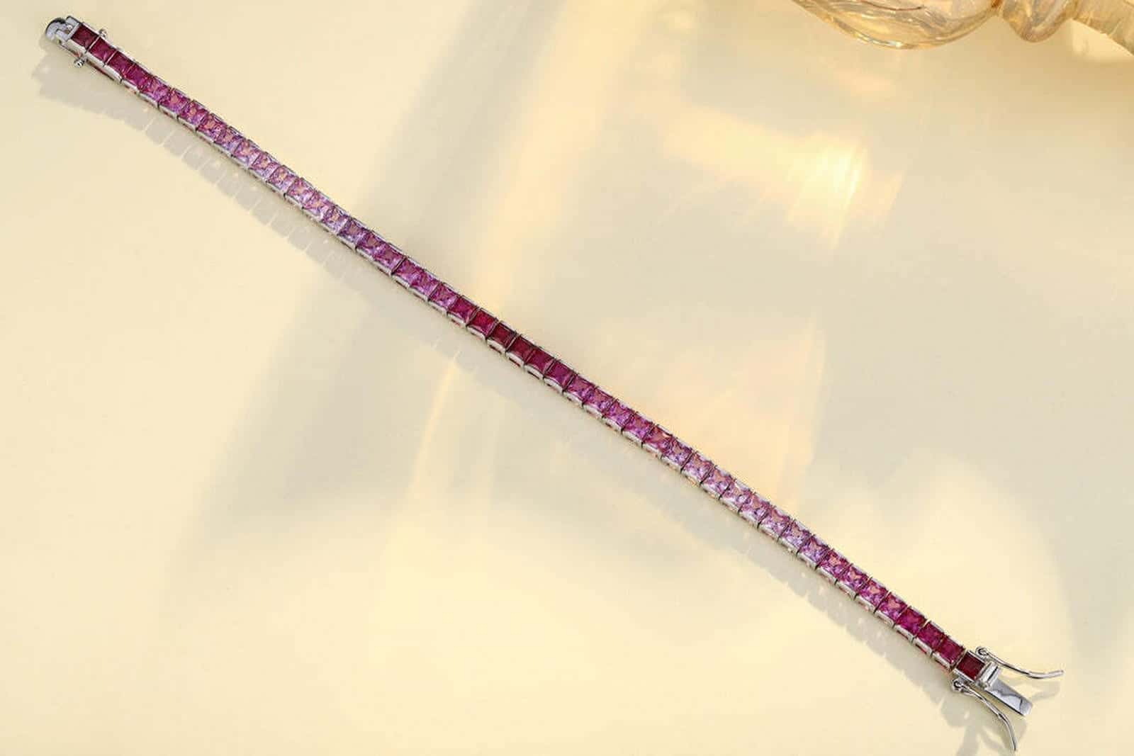 The bracelet made from S925 silver features an ingenious and easy-to-use clasp design. Lab-grown colored sapphires are pink-p