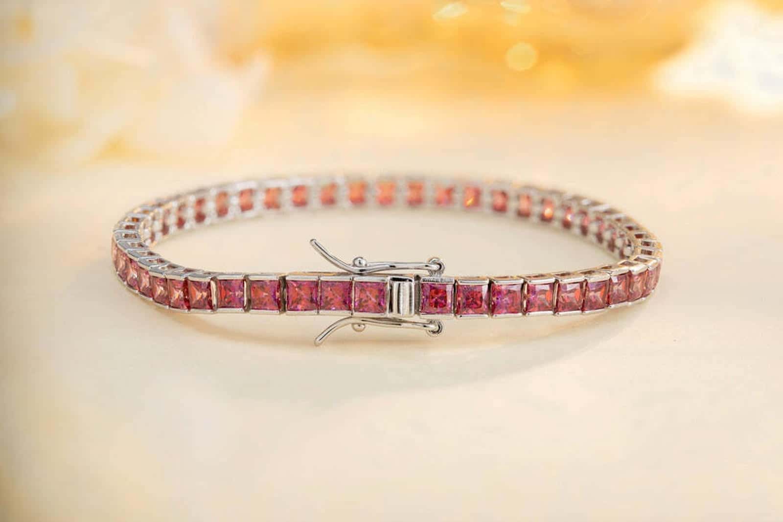 This bracelet is crafted from S925 silver with a delicate and durable clasp design. The pink lab-grown colored sapphires shin