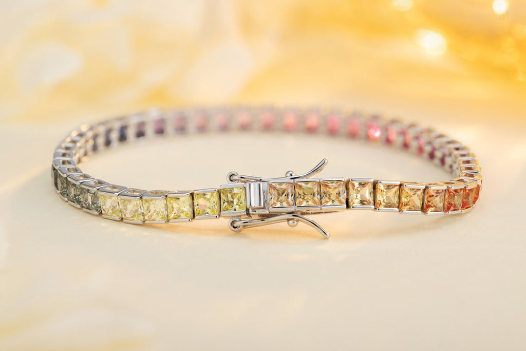 This silver jewelry (925 silver) has a delicate clasp design, square colored gems connected into a chain, with gorgeous color