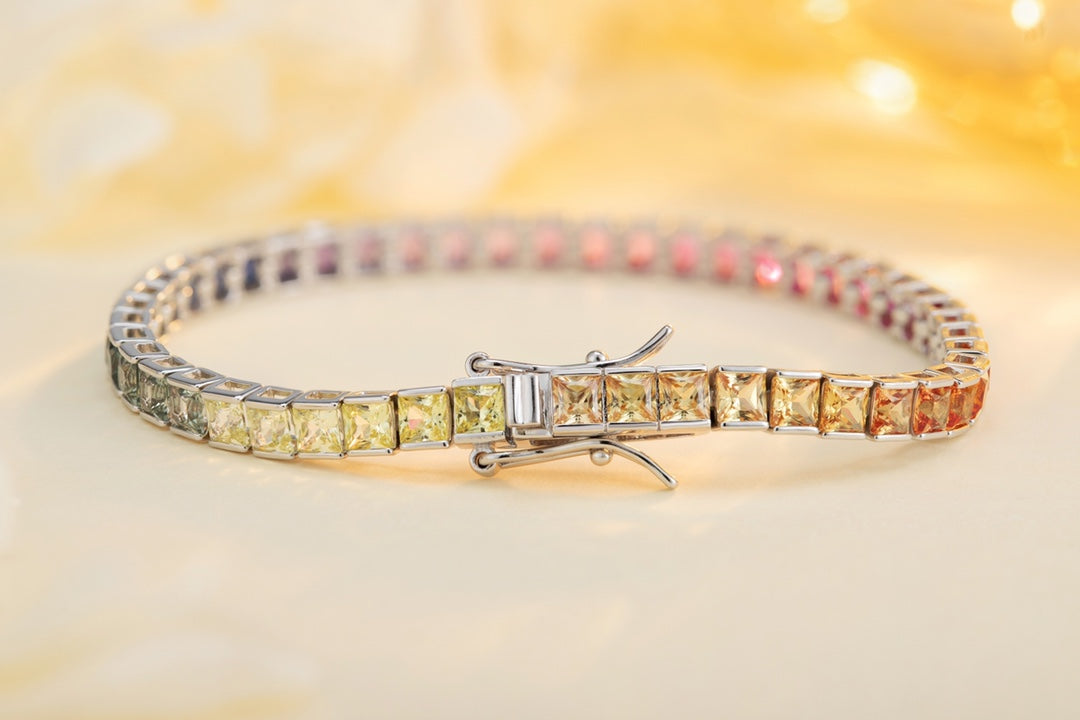 This silver jewelry (925 silver) has a delicate clasp design, square colored gems connected into a chain, with gorgeous color