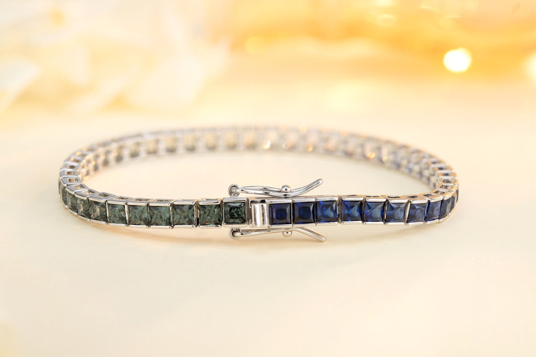 This silver jewelry (925 silver) has a delicate clasp design, connected square colored gems, with blue, green and other color