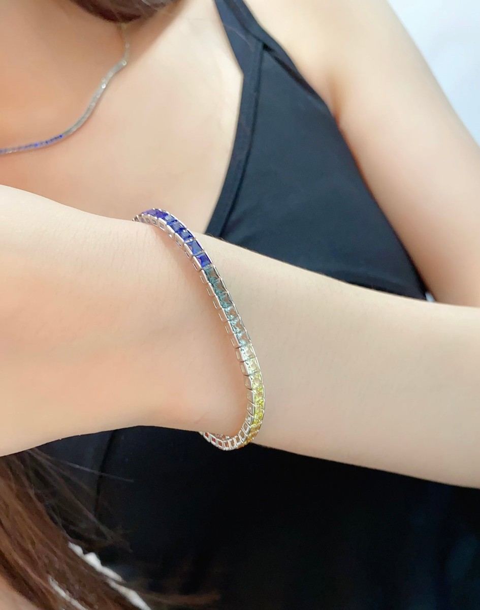 This bracelet features a pure and cool silver-white S925 base color, while the lab-grown colored sapphires are like a spilled