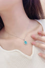This S925 silver necklace has a fine clasp. Features an oval bright - blue pendant with diamond halo, nice design.