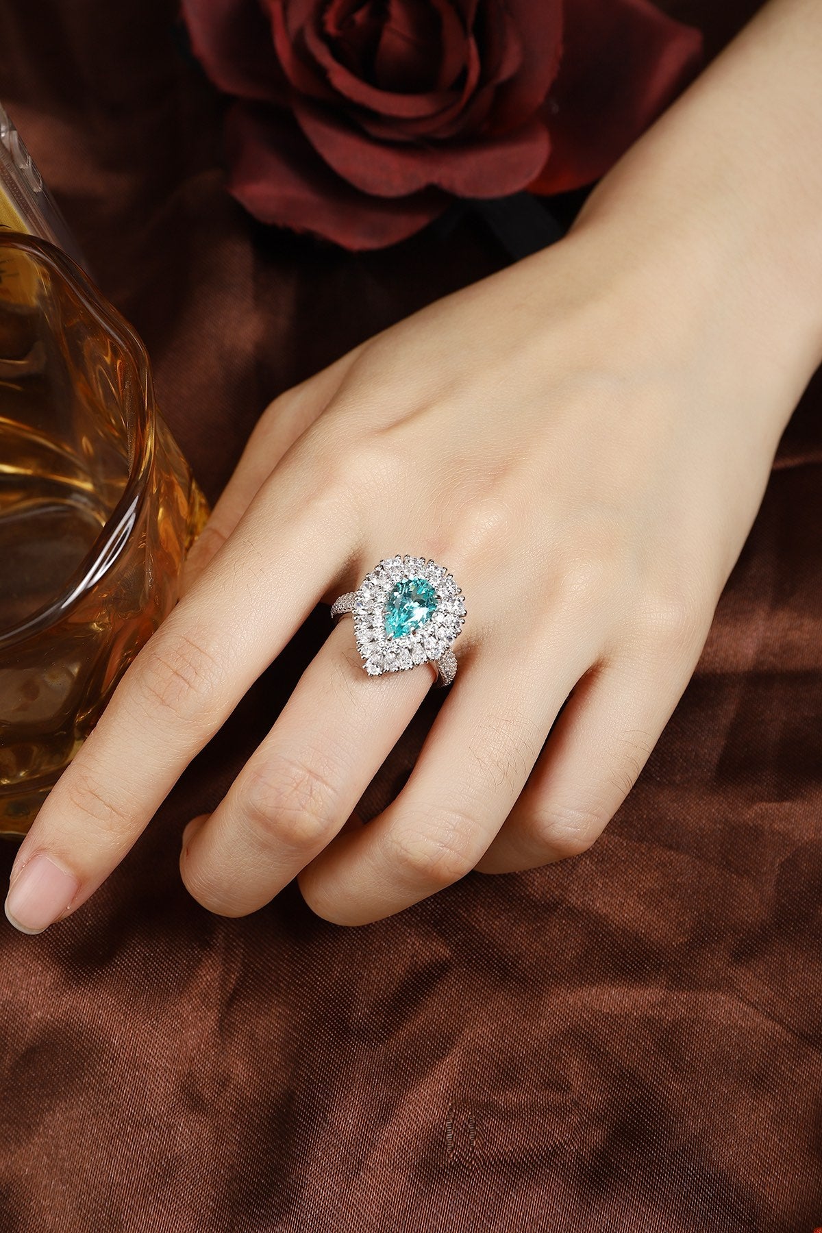 This S925 silver ring has a closed - ring structure. Features a round vivid blue lab - grown gem with diamond frame, no openi