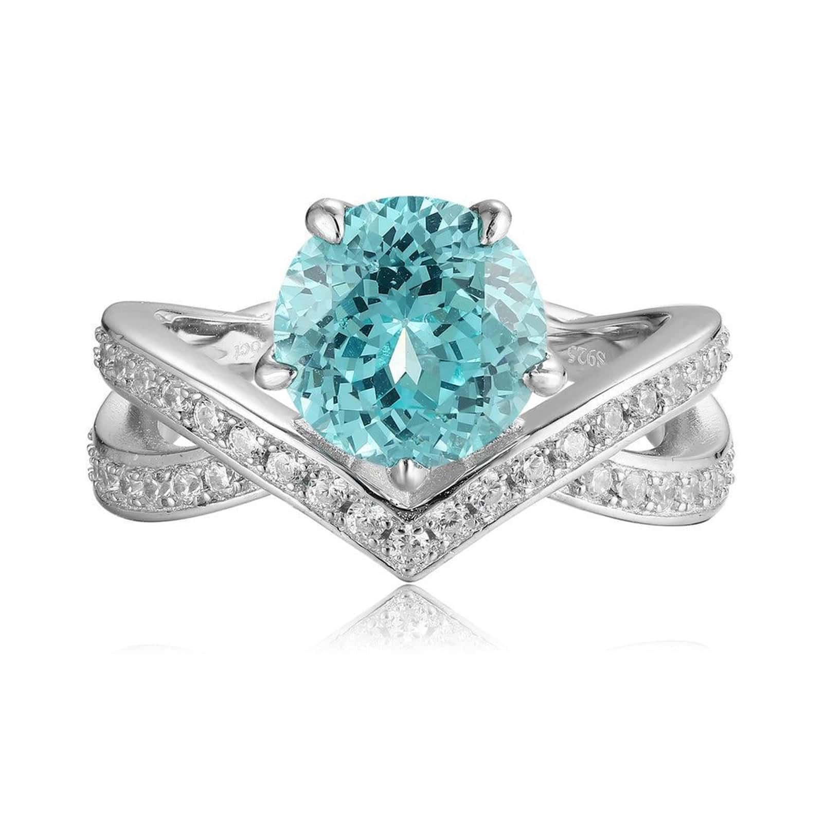 S925 silver ring with opening design. Cross - over band with pave diamonds, round lab - grown blue gem at center, elegant V -