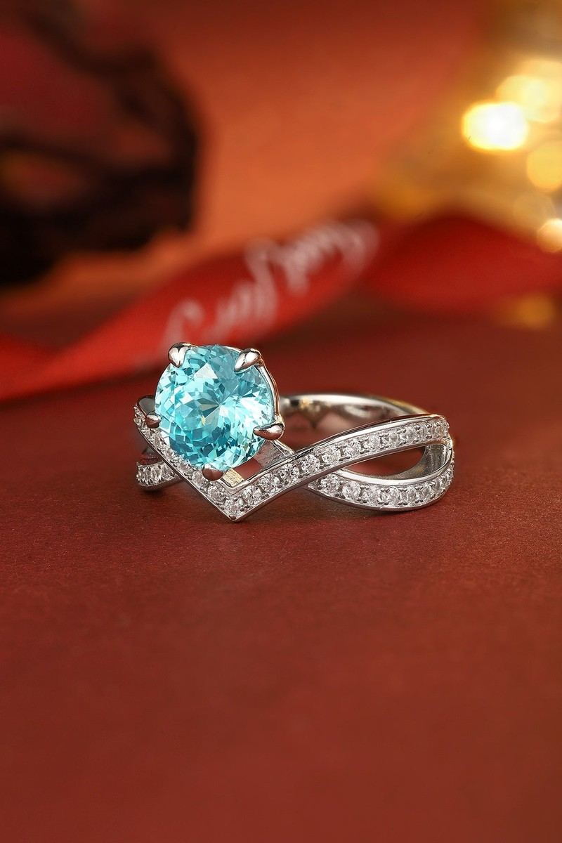 The S925 silver ring boasts an opening design. V - shaped cross - over band with diamond accents, round blue gem, attractive.