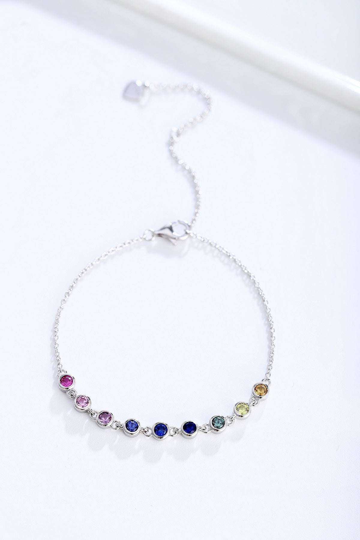 S925 silver piece, colorful sapphires arranged, round form, clasp with extender, charming.