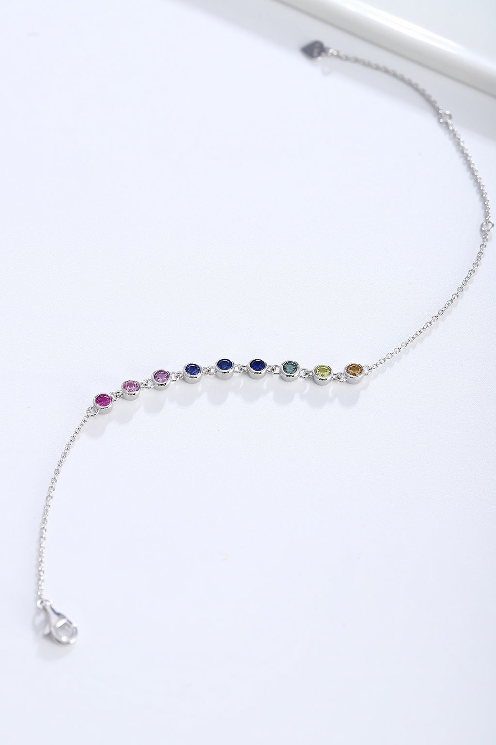 S925 silver bracelet, rainbow - like sapphires, round gems, secure clasp and extender, nice.