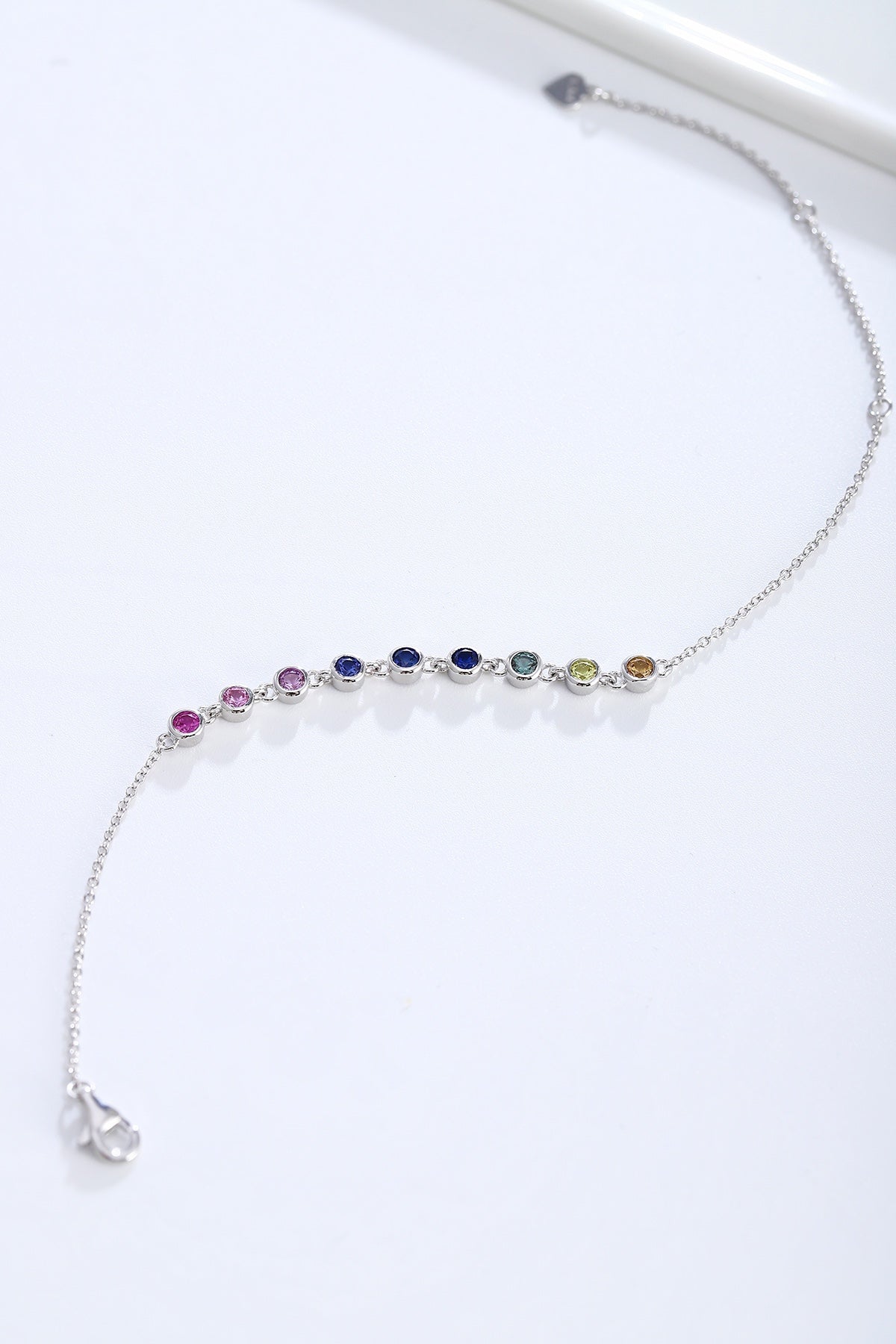 S925 silver bracelet, rainbow - like sapphires, round gems, secure clasp and extender, nice.