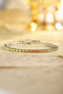 The S925 silver bracelet has a reasonable and secure clasp design. The lab-grown colored sapphires show a yellow-orange gradi